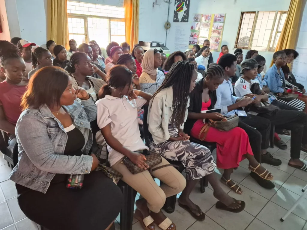 Participants seated in a room during a youth capacity-building session