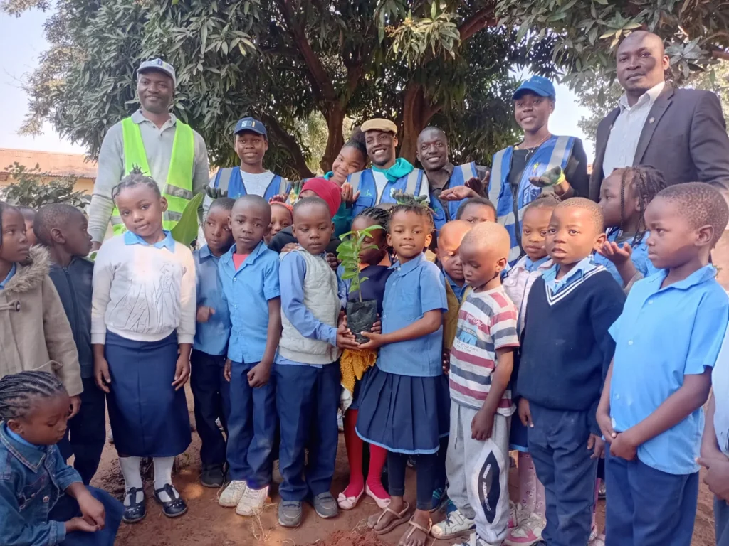 Children gathered with instructors for a planting activity