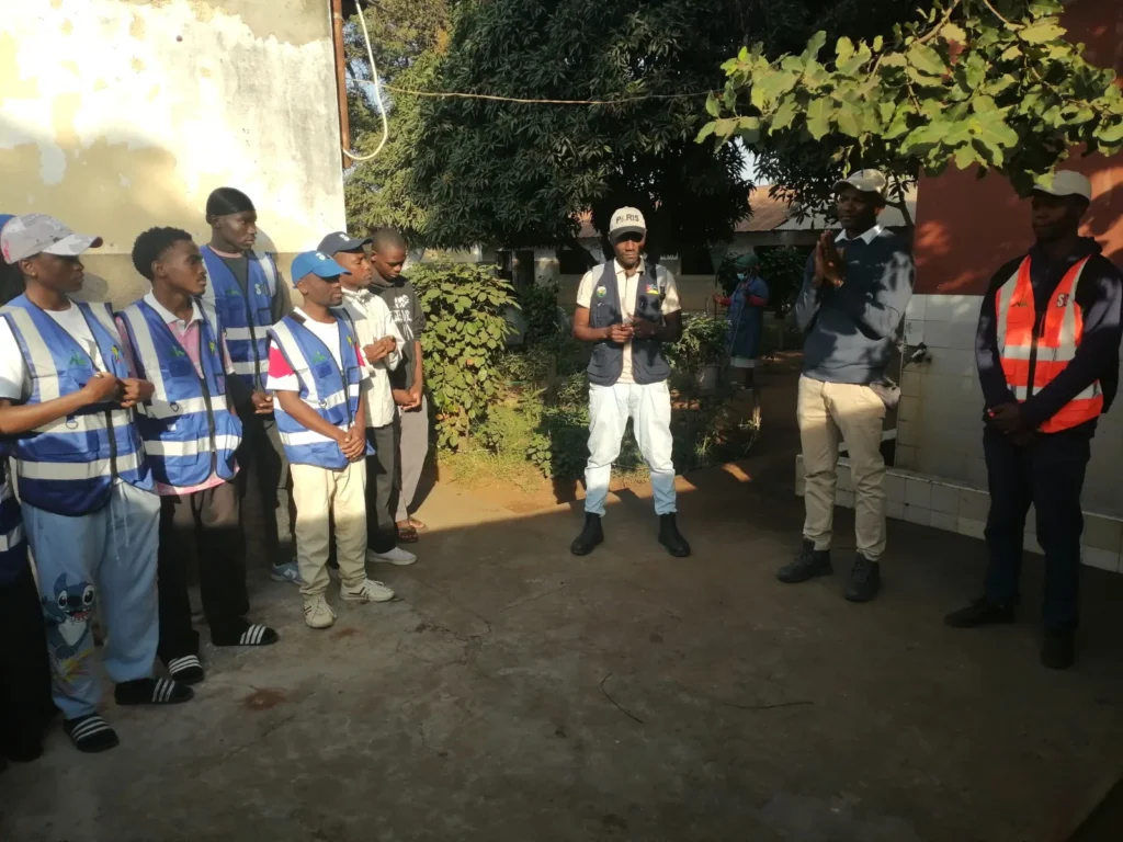 Volunteers in vests preparing for a litter collection